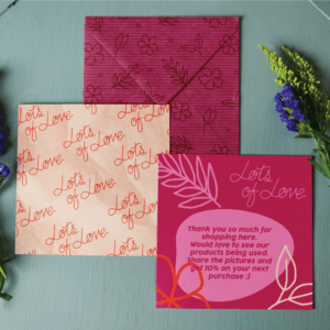 Branding packages-pink and orange printed postcard and envelope on an olive background